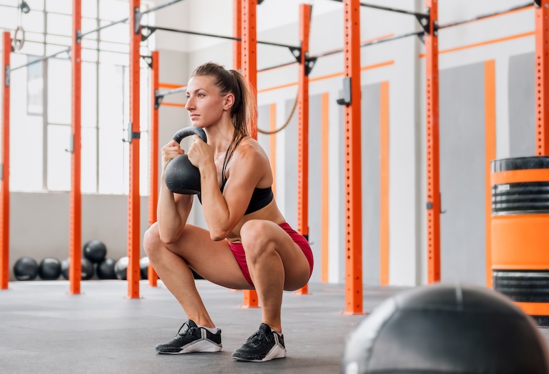 Performing_Squats_With_Kettlebell_original_1209096_1747703544